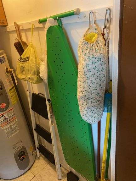 Contents of kitchen closet, step stool, ironing board, brooms, extension cords (excludes items on shelf) image