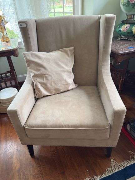 Beige upholstered chair with nailhead trim & pillow image