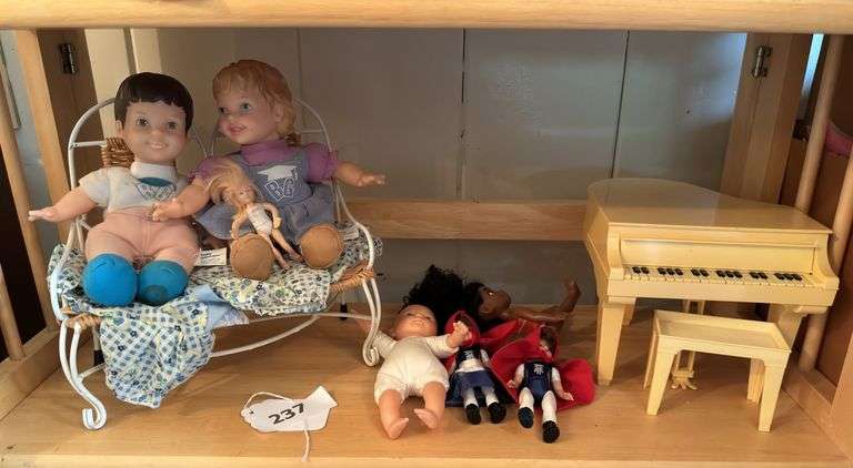 3rd shelf of dolls image