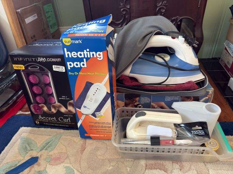 Curlers, heating pad, massager, iron image