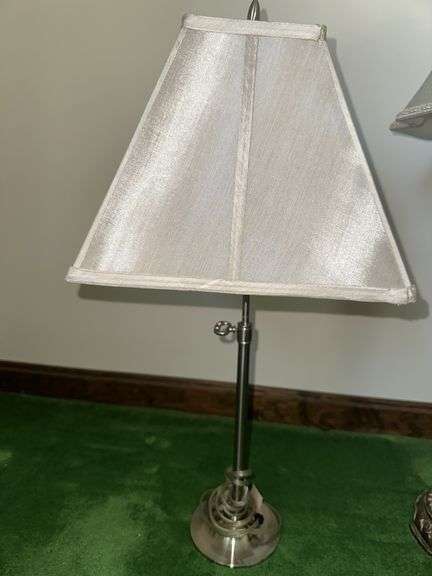 Table lamp with glass cylinder base and silver decorative accents and checked shade 36” tall, metal base lamp with triangle shade 26” tall