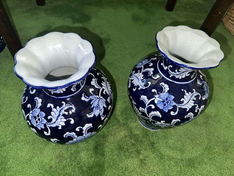 Pair of blue and white decorative vases with scalloped tops