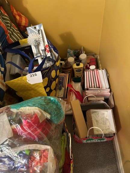 Bags of lotion mostly Bath and Body Works , sprays, bows, bags, and paper.  Scrub brush’s, journals, and misc image