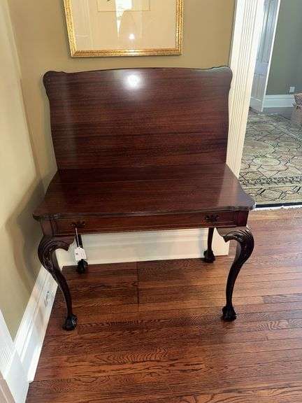 Antique table with built in drop leaf and claw feet and drop down legs