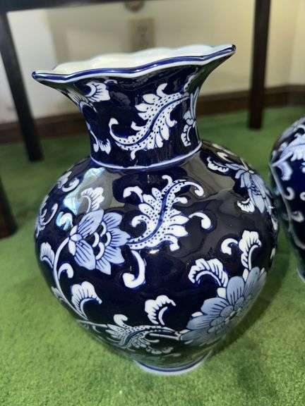 Pair of blue and white decorative vases with scalloped tops