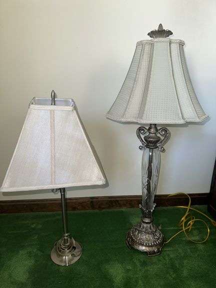 Table lamp with glass cylinder base and silver decorative accents and checked shade 36” tall, metal base lamp with triangle shade 26” tall