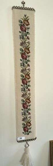 Antique bell pull with cross stitch, ornate framed mirror