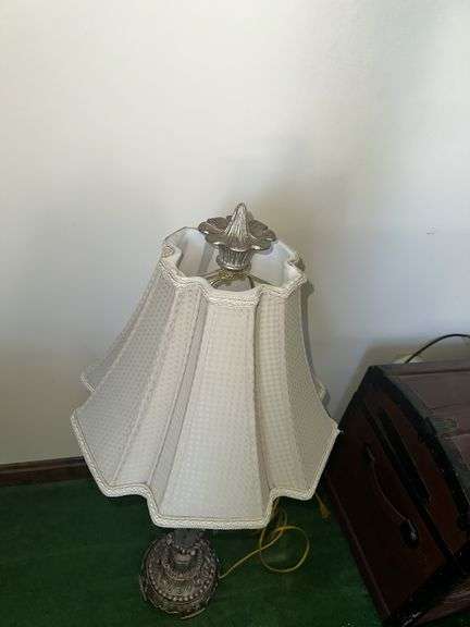 Table lamp with glass cylinder base and silver decorative accents and checked shade 36” tall, metal base lamp with triangle shade 26” tall