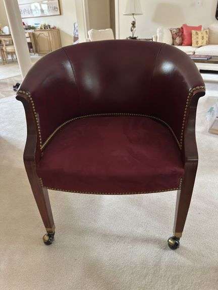 Barrel back with leather back and suede seat on casters with brass nailhead accents image