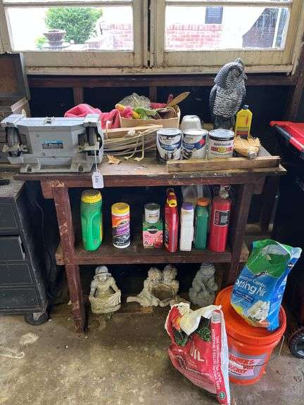 Wood bench w/ double end grinder, yard chemicals, rope, plastic owl & misc image