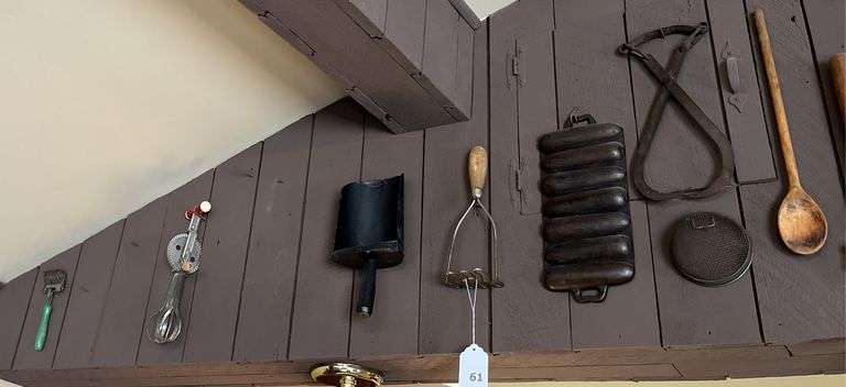 Antique kitchen utensils on wall
