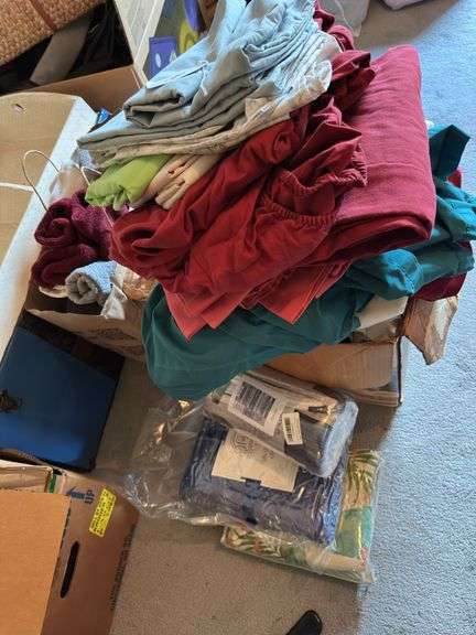 Sack of towels, sheets, pillowcases, new blanket, new shams, image