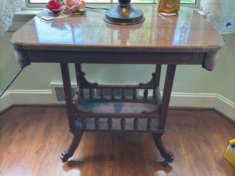 Antique marble top table on rollers image