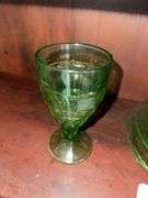 Uranium glass sherbets, stemmed glasses, cup, green depression glass plates, glass