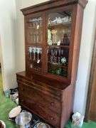 2 piece Antique walnut step back cabinet with wavy glass doors