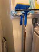 Contents of kitchen closet, step stool, ironing board, brooms, extension cords (excludes items on shelf)