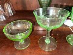 Uranium glass sherbets, stemmed glasses, cup, green depression glass plates, glass