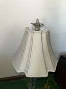 Table lamp with glass cylinder base and silver decorative accents and checked shade 36” tall, metal base lamp with triangle shade 26” tall