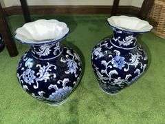 Pair of blue and white decorative vases with scalloped tops