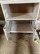 Roll around cabinet, tablecloths, rug, towel