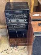 Sound design stereo, wood cabinet, books