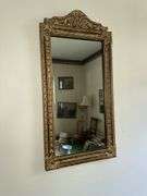 Antique bell pull with cross stitch, ornate framed mirror