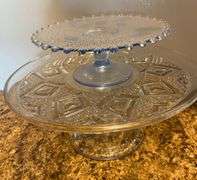 Clear glassware, cake stand, am dessert stand, round butter dish, cruets, bowl