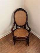 Antique carved back rocker w/ cane seat & back