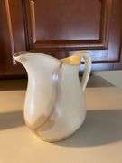 3 pitchers, 2 plates, bowl