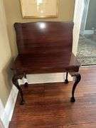 Antique table with built in drop leaf and claw feet and drop down legs