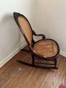 Antique carved back rocker w/ cane seat & back