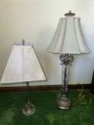 Table lamp with glass cylinder base and silver decorative accents and checked shade 36” tall, metal base lamp with triangle shade 26” tall