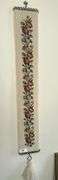 Antique bell pull with cross stitch, ornate framed mirror