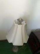 Table lamp with glass cylinder base and silver decorative accents and checked shade 36” tall, metal base lamp with triangle shade 26” tall