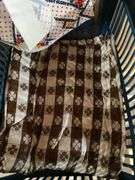 Roll around cabinet, tablecloths, rug, towel