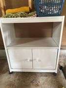 Roll around cabinet, tablecloths, rug, towel