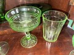 Uranium glass sherbets, stemmed glasses, cup, green depression glass plates, glass