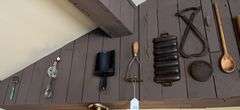 Antique kitchen utensils on wall