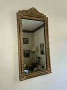 Antique bell pull with cross stitch, ornate framed mirror