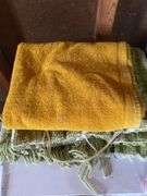 Roll around cabinet, tablecloths, rug, towel
