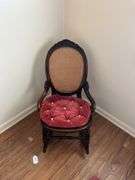 Antique carved back rocker w/ cane seat & back