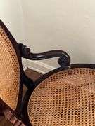 Antique carved back rocker w/ cane seat & back