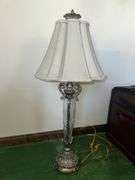 Table lamp with glass cylinder base and silver decorative accents and checked shade 36” tall, metal base lamp with triangle shade 26” tall