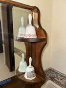 Porcelain dresser box, 2 perfume bottles (one has broken stopper), brass bell, 2 china bells, candle