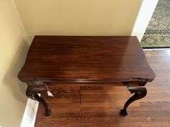 Antique table with built in drop leaf and claw feet and drop down legs