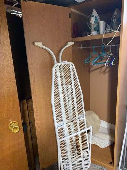 Ironing board, 2 irons, contents of 2 wood cabinets image