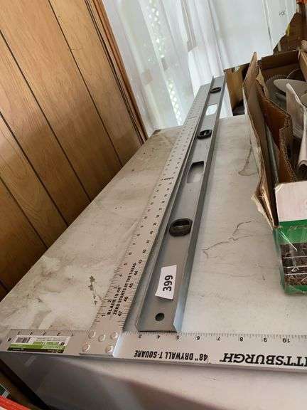 Level, T-square, yard sticks, crowbar, weed auger image
