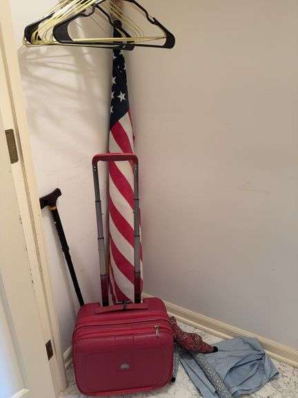 Rolling bag on wheels, cane, American flag (has worn spots) image