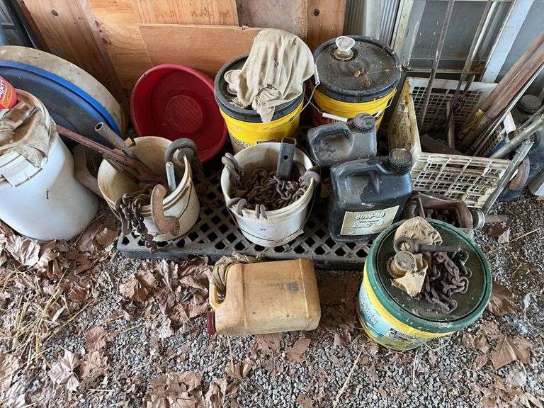Plastic pallet, chains and buckets image