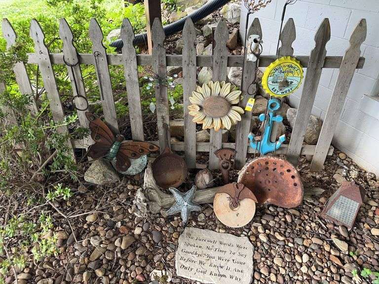 Misc garden decor, tractor seat and grinding stone image